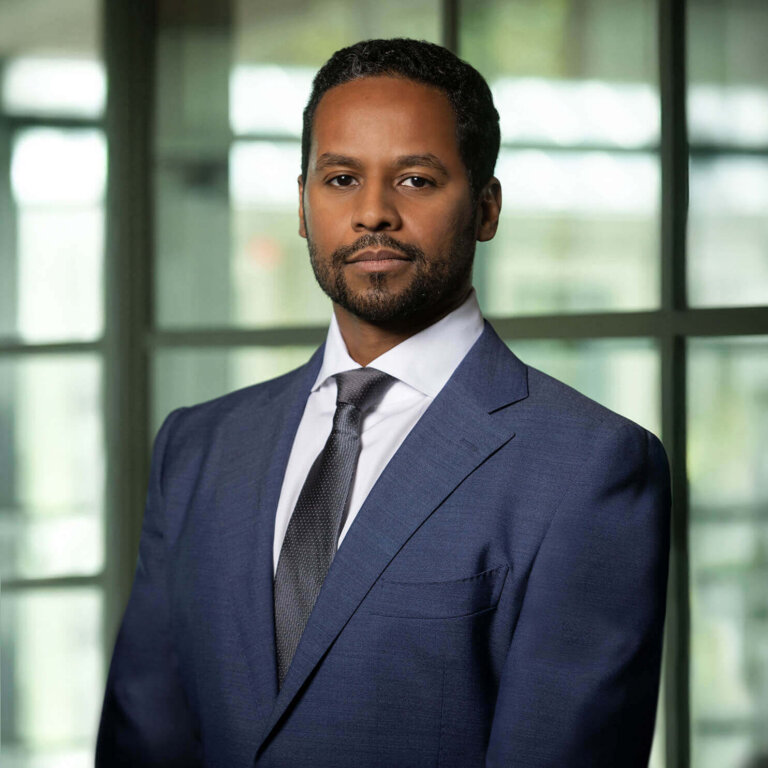 Confident professional man in blue suit and tie