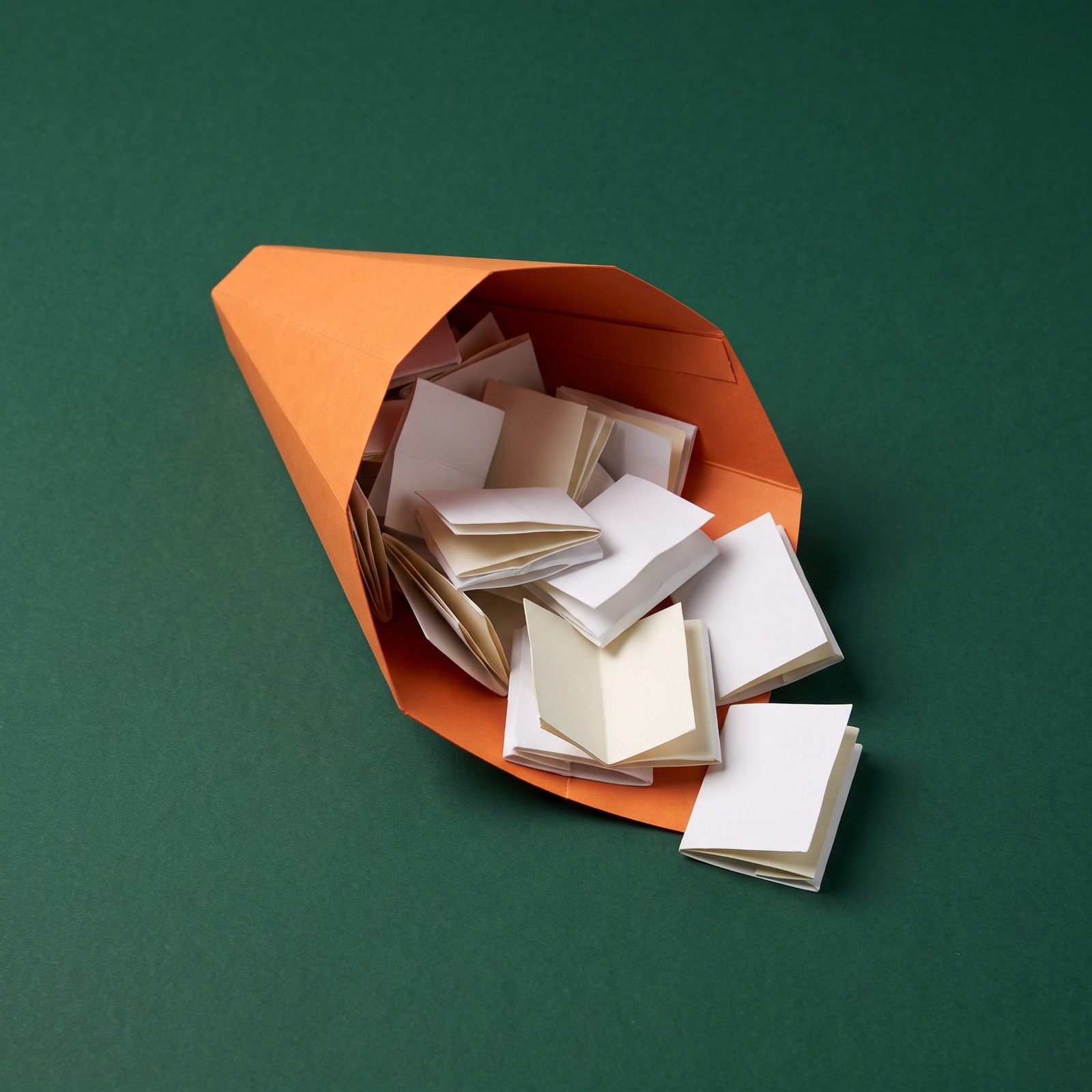 Paper sculpture of a funnel filled with loose pages
